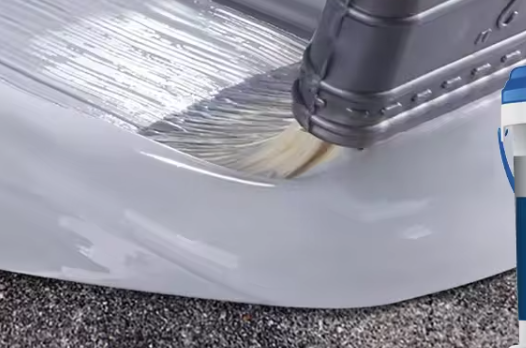 A person is painting a car with a brush.