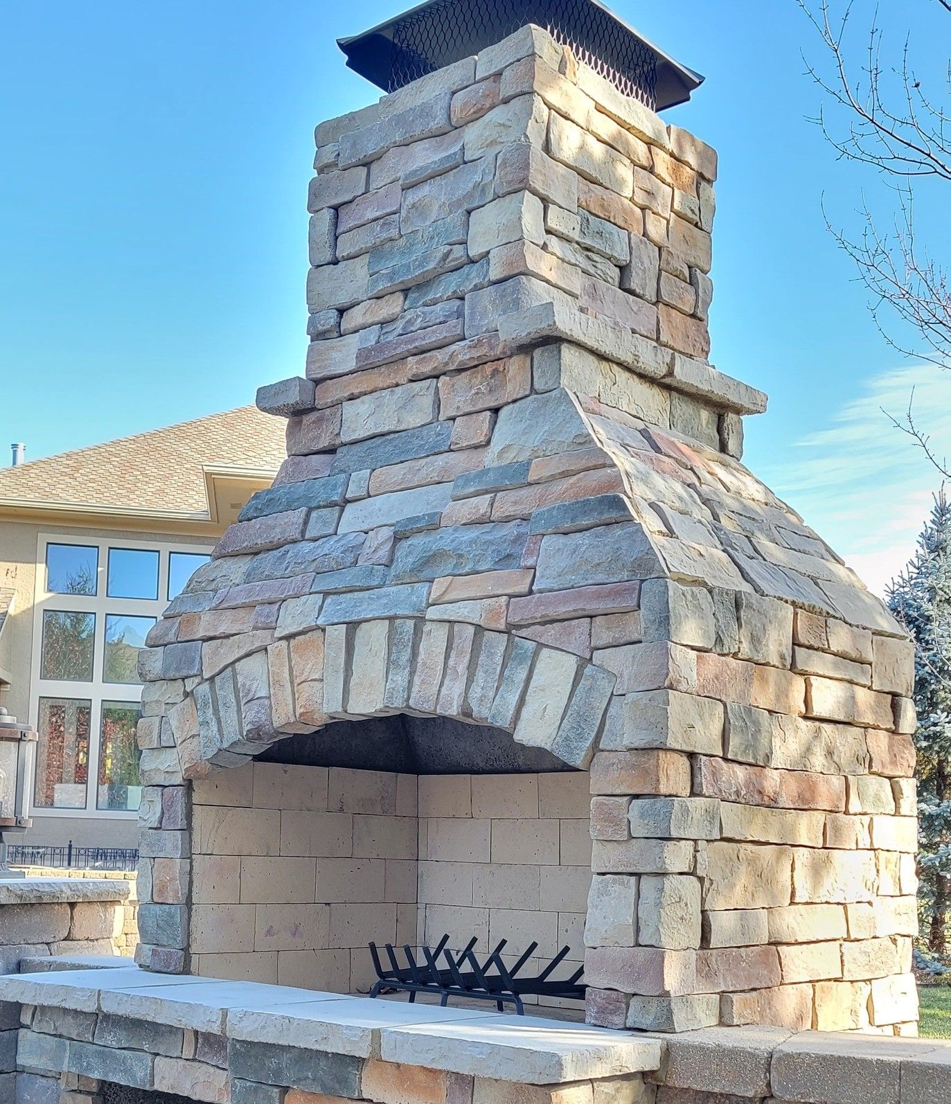 A brick fireplace with a chimney on top of it