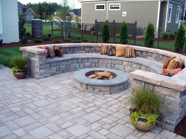There is a fire pit in the middle of the patio.