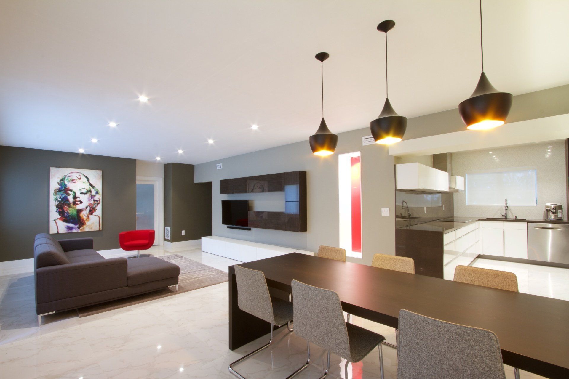 a living room with a couch and a table and chairs