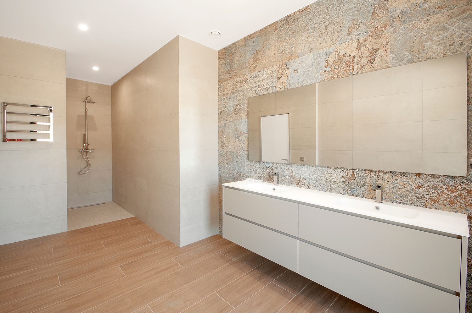 Modern bathroom with a frameless glass shower and custom shower mirror