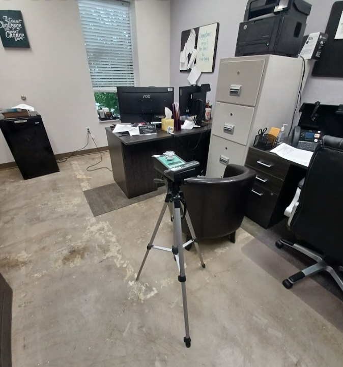 An office with a sign on the wall that says home delivery cargo