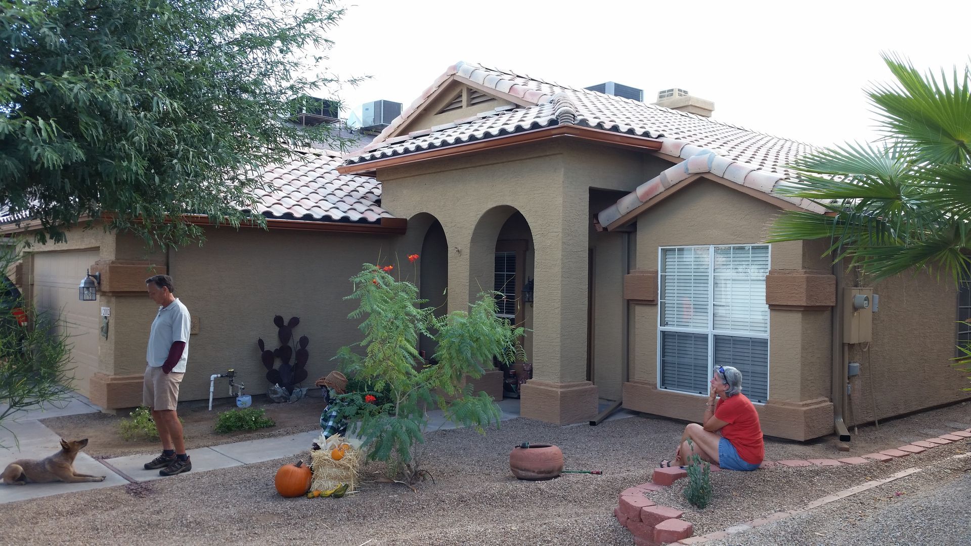 Technician repairing a sagging gutter section on a home in Chandler, AZ.