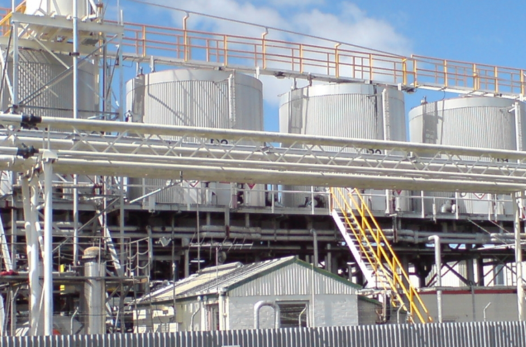 A factory with a lot of tanks and pipes