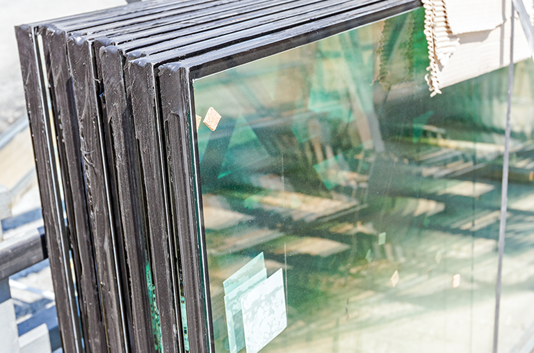 A stack of glass sitting on top of each other on a table.
