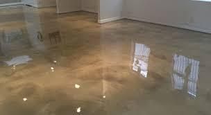 Flooded room with standing water reflecting windows and walls on a hardwood floor