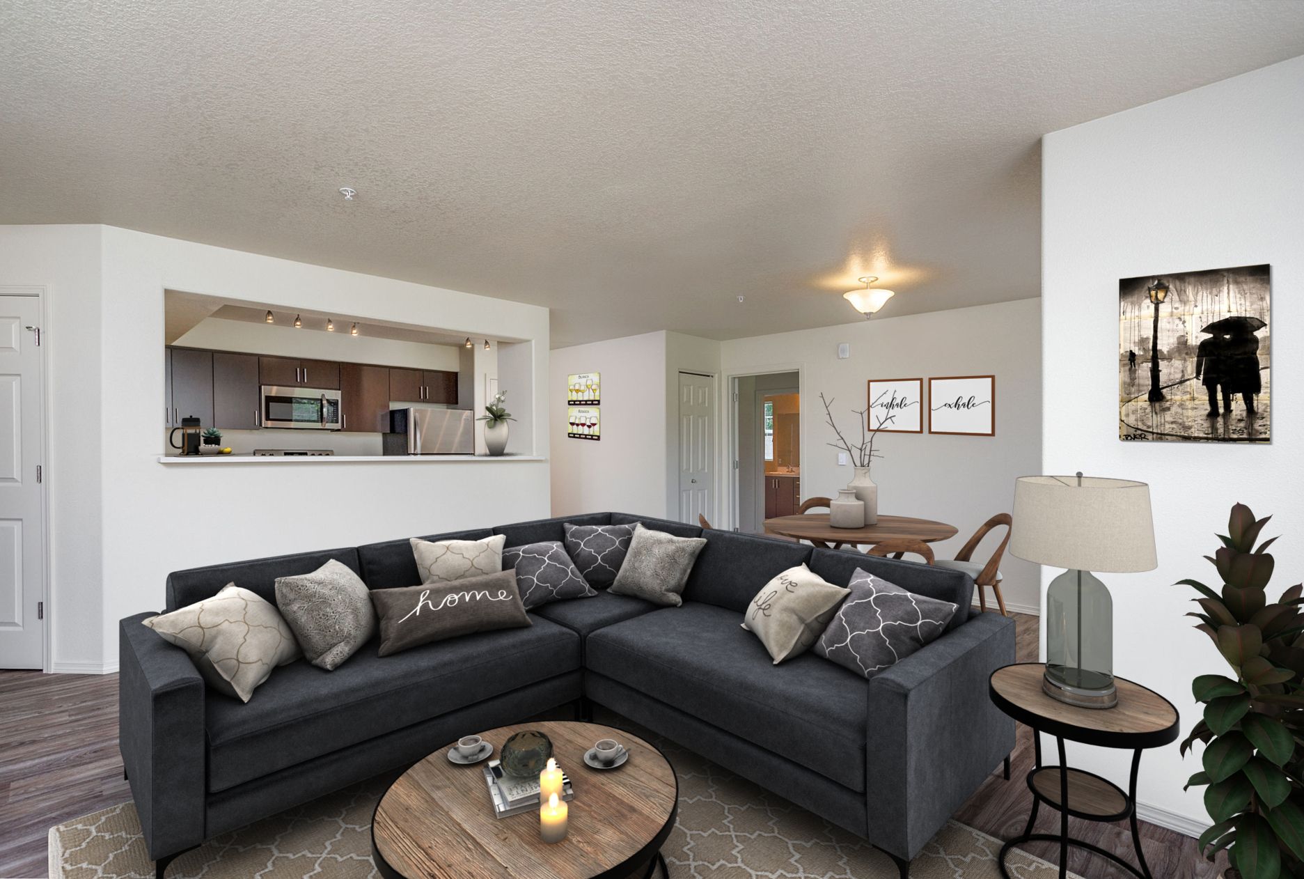 A living room with a large sectional couch and a coffee table