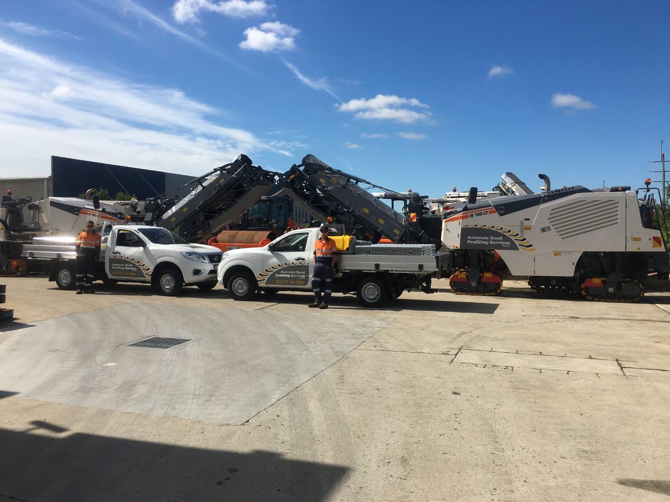 Two ARPS Workers Standing Beside The Two Vehicles — Road Profiling in Caboolture, QLD