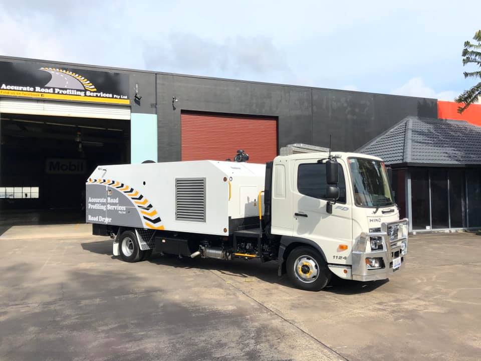 Side View Of Road Dryer Truck Outside The Garage — Road Profiling in Caboolture, QLD