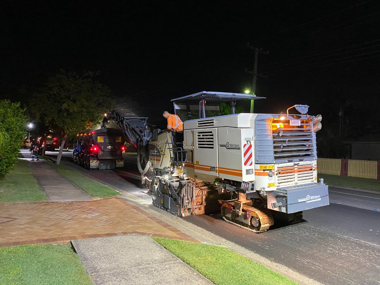 Wirtgen Machine And Truck On A Hill Road — Road Profiling in Caboolture, QLD