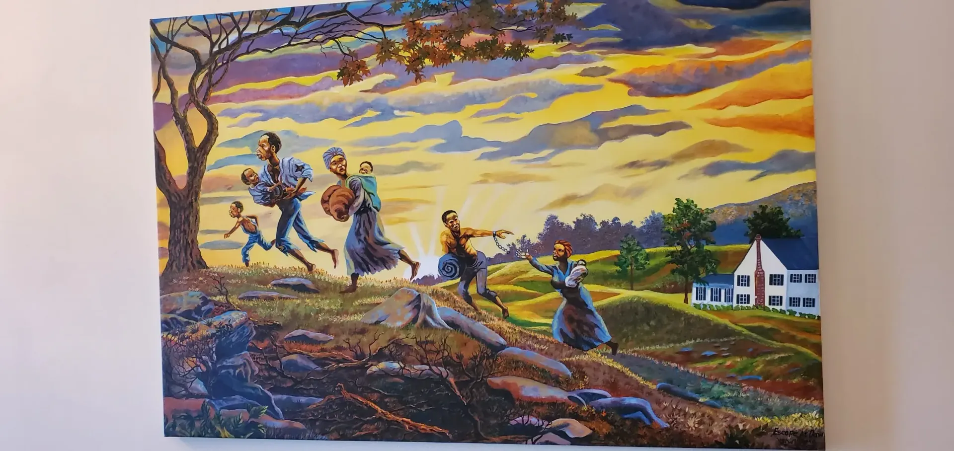 Diamond painting depicting a family fleeing at sunset past a house.