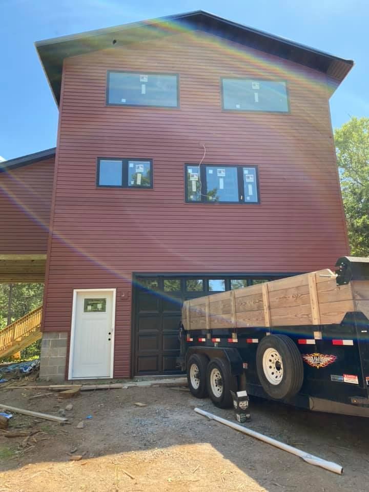 A large house with a truck parked in front of it.