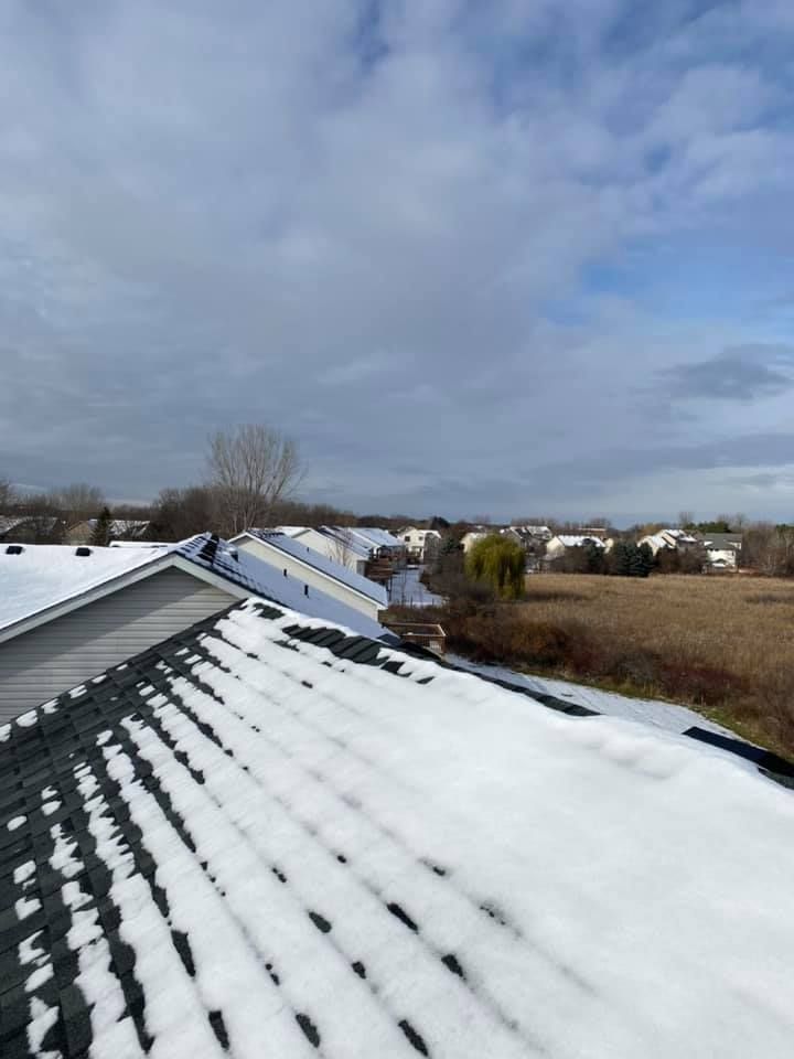 The roof of a house is covered in snow.