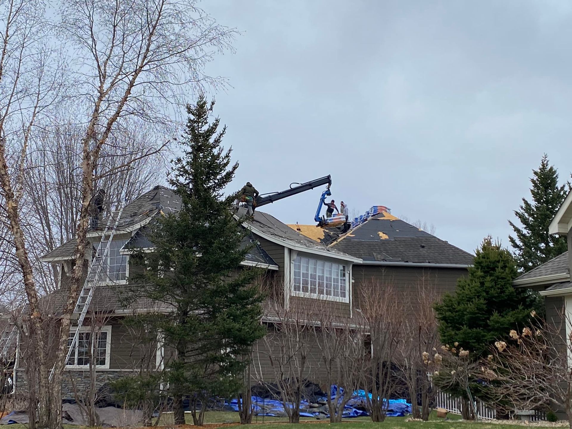 A large house with a crane on top of it.