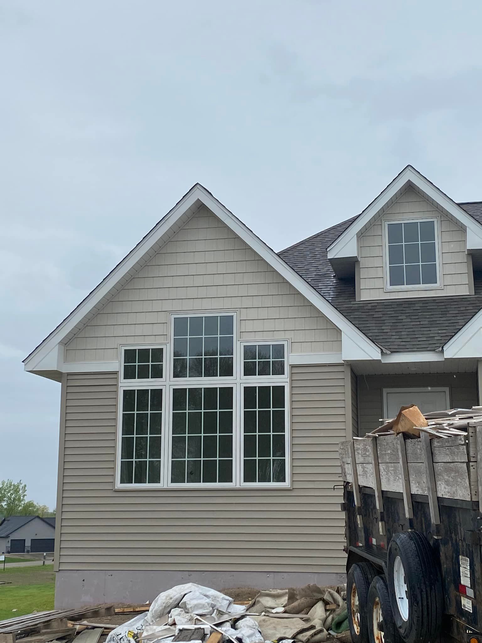 A house with a lot of windows is being built.