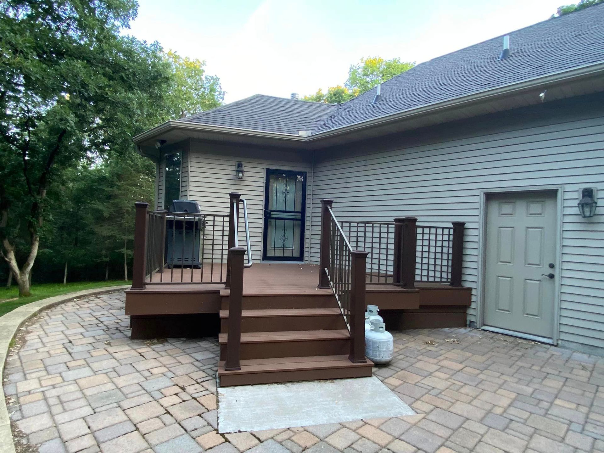 The back of a house with a deck and stairs
