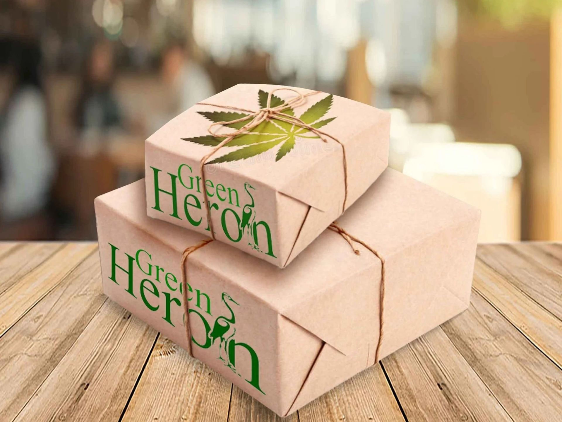 Two packages wrapped in brown paper, with a marijuana leaf and