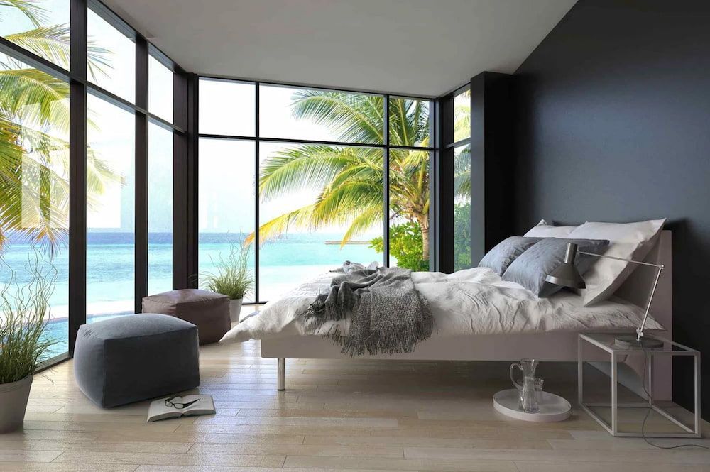 A Bedroom with a Large Bed — D’Art Interiors in Eureka, NSW