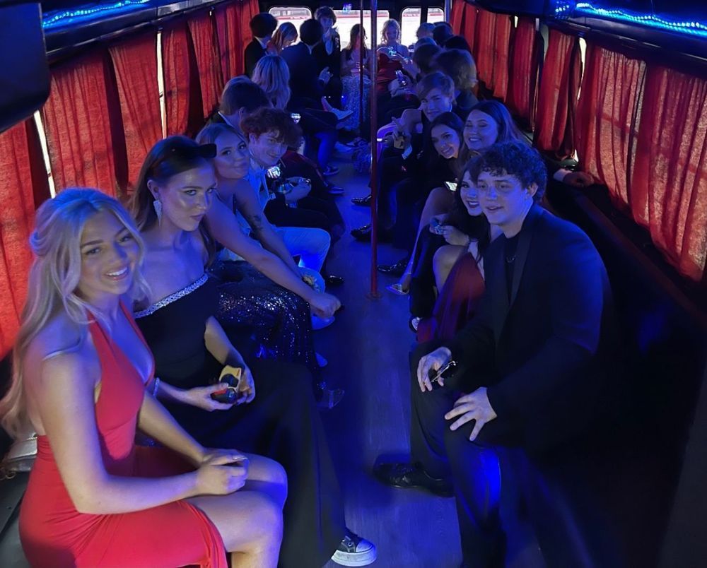 A group of people are sitting on a bus.