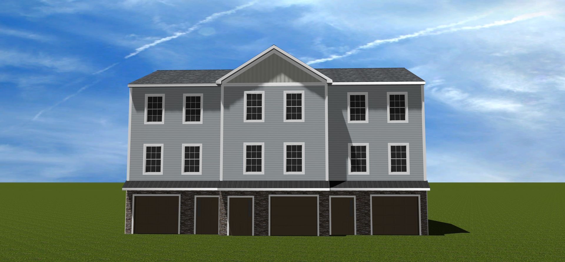 A three-story, grey residential building with a stone-accented ground floor, multiple garages, and a pitched roof.