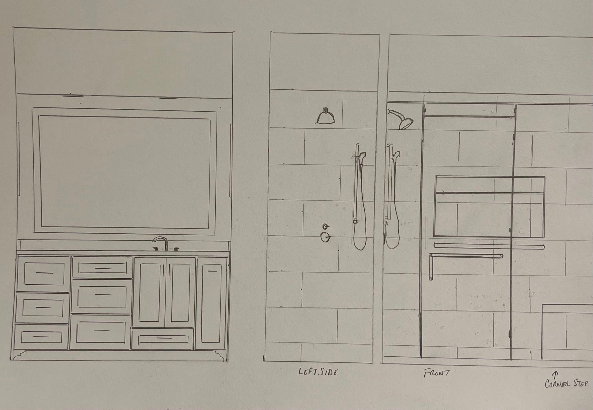 A hand-drawn sketch of a bathroom layout showing a vanity with a mirror next to a tiled shower stall.