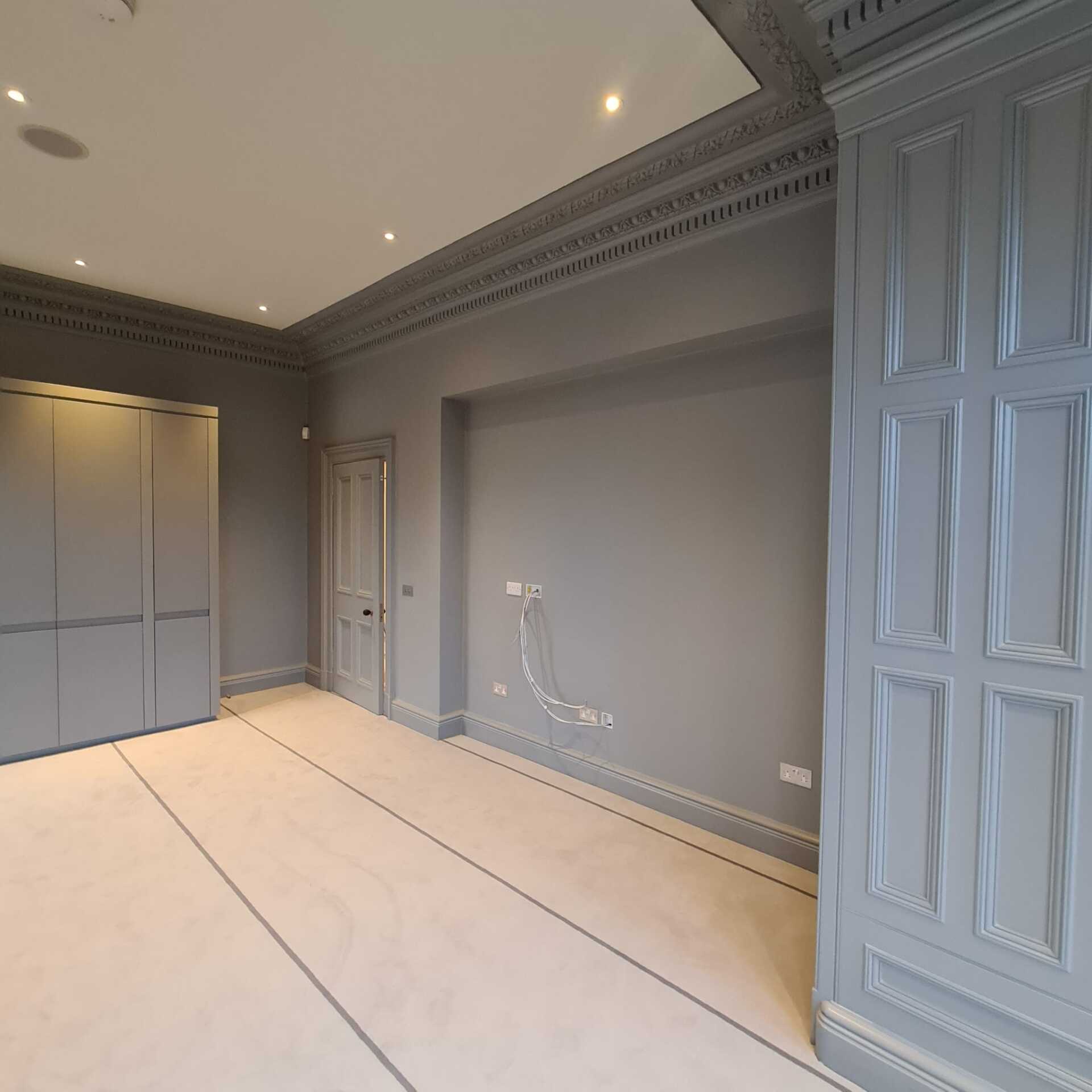 Picture of a panelled wall painted in sage green by Painters and Decorators Edinburgh