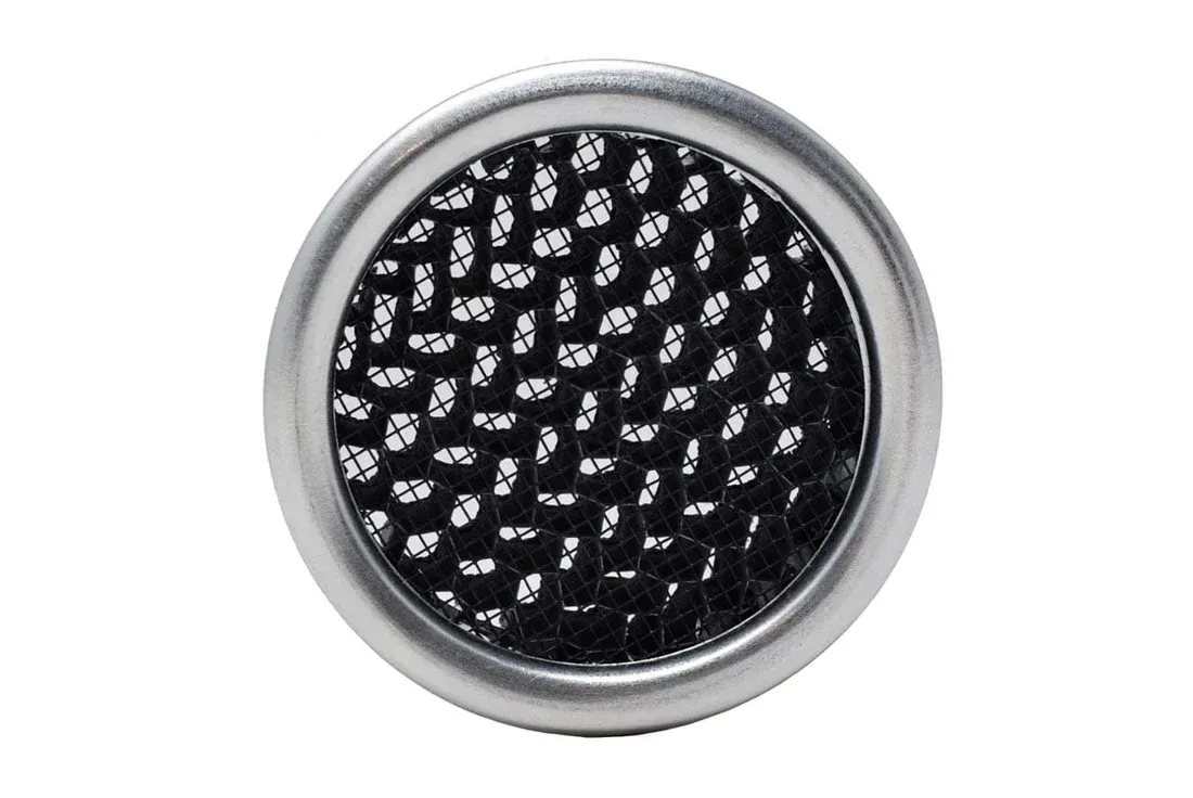 Round black textured button with a silver rim on a white background