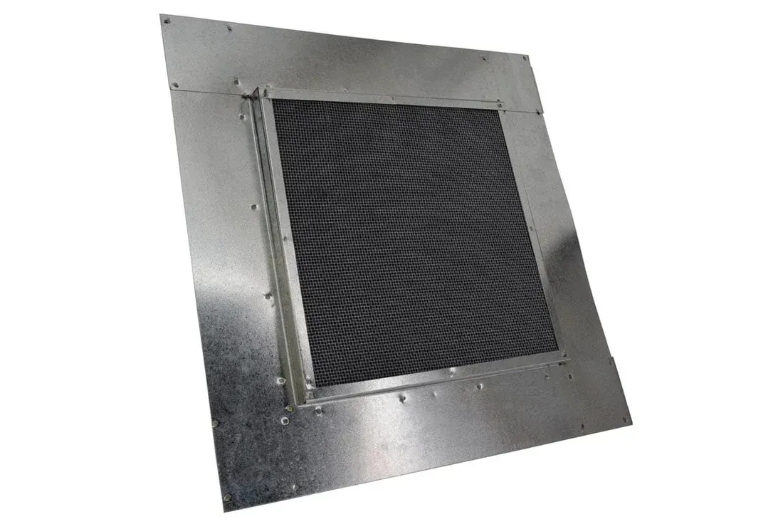 Metal vent grille with a dark mesh center on a silver panel