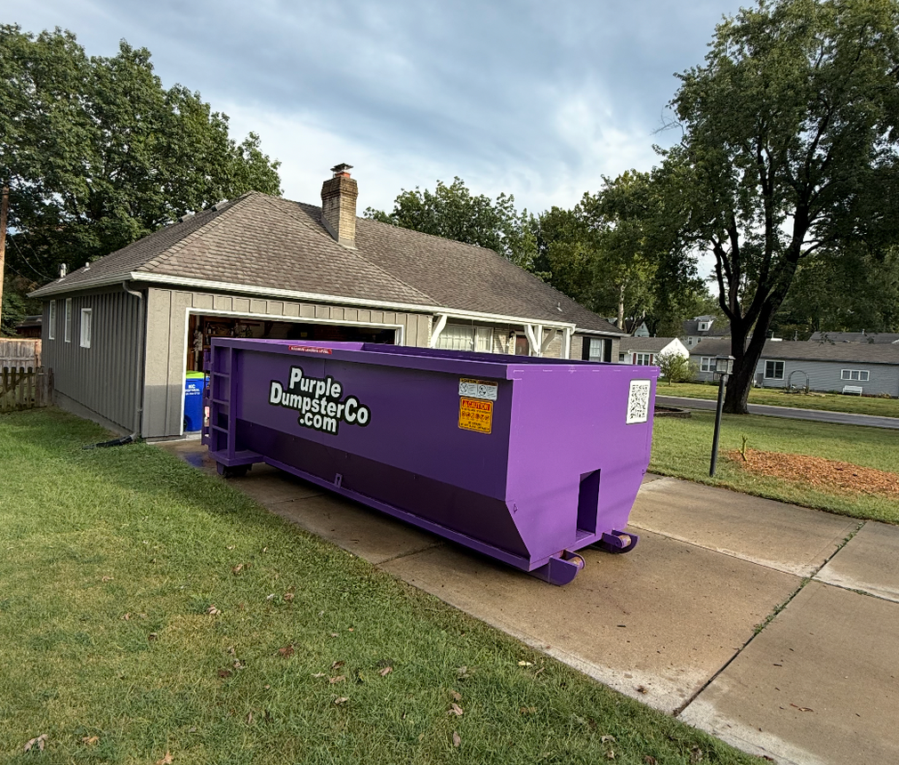 Purple Dumpster Co dumpster truck in Kansas City ready to haul