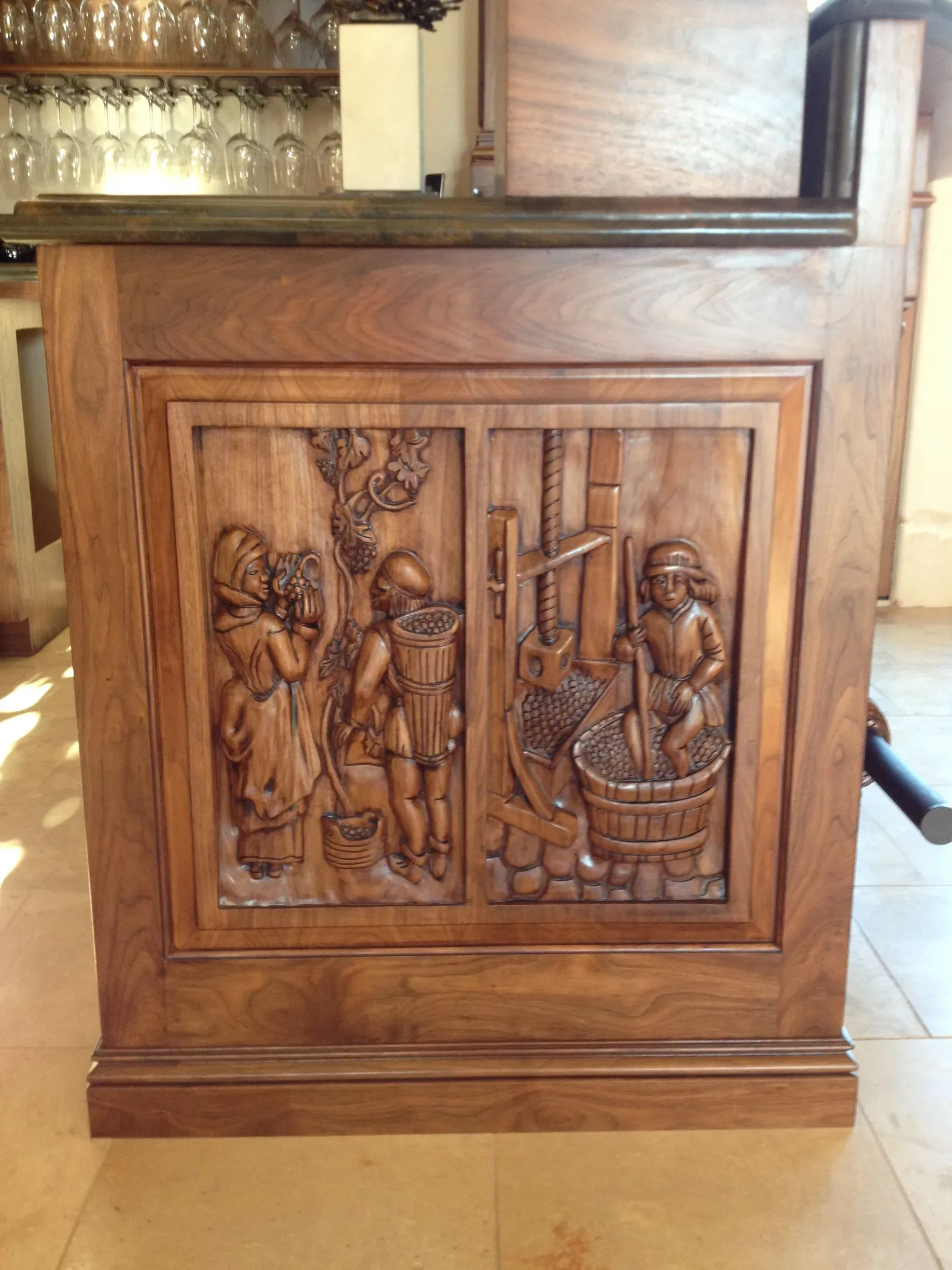 Wooden carved bar front with relief panels and decorative molding