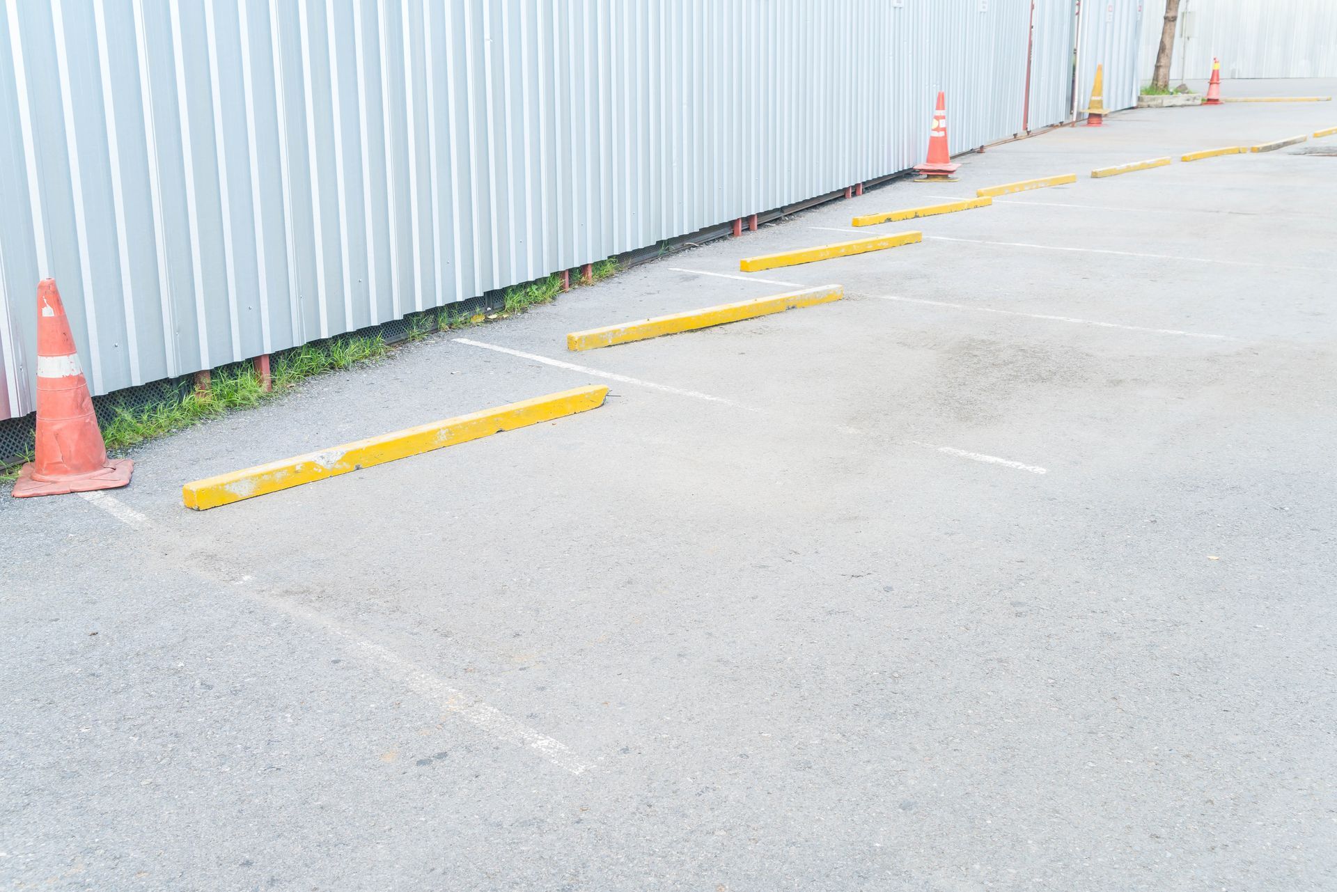 Fading parking lot lines in need of restriping.