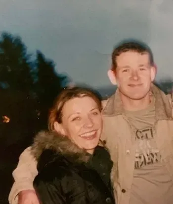 A man and a woman are posing for a picture together.