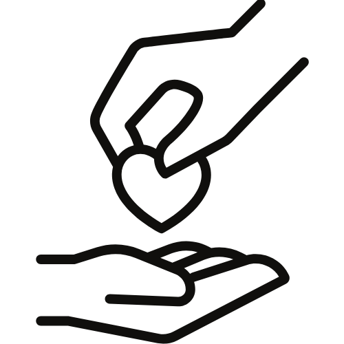 Hands dropping a heart into another open hand symbolizing care or charity