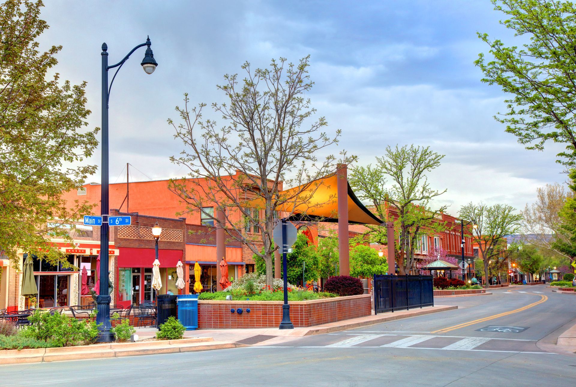 a city street with a few buildings and a street light