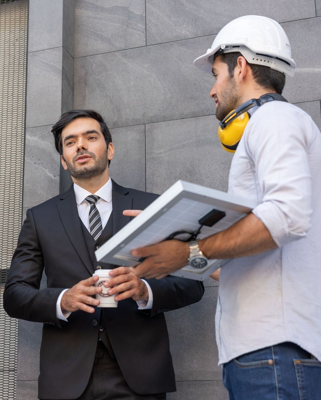 worker going through a lighting audit with a customer