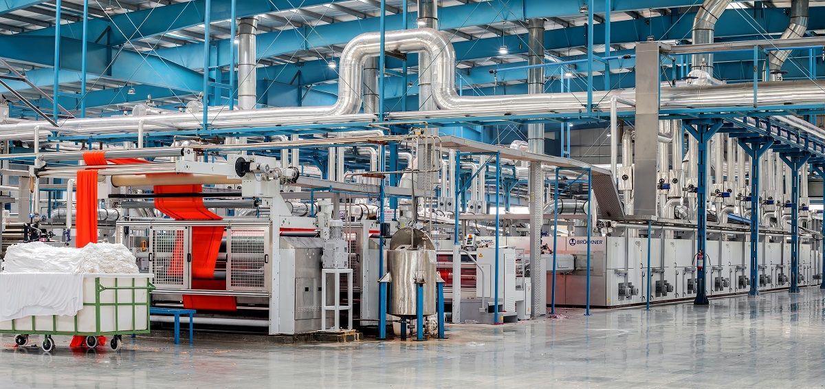 A factory filled with lots of machinery and pipes.