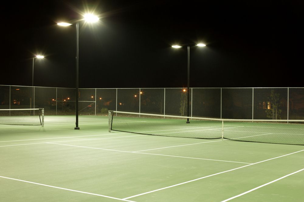 tennis court pictured at night with new LED lighting
