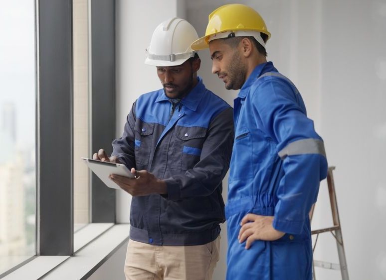 two lighting certified experts from US Lighting Systems working on a commercial LED installation project in Houston