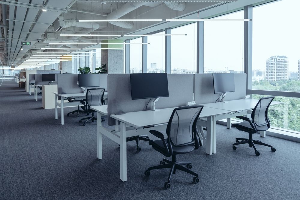 office with new LED lighting and lots of windows/natural lighting to help with employee productivity