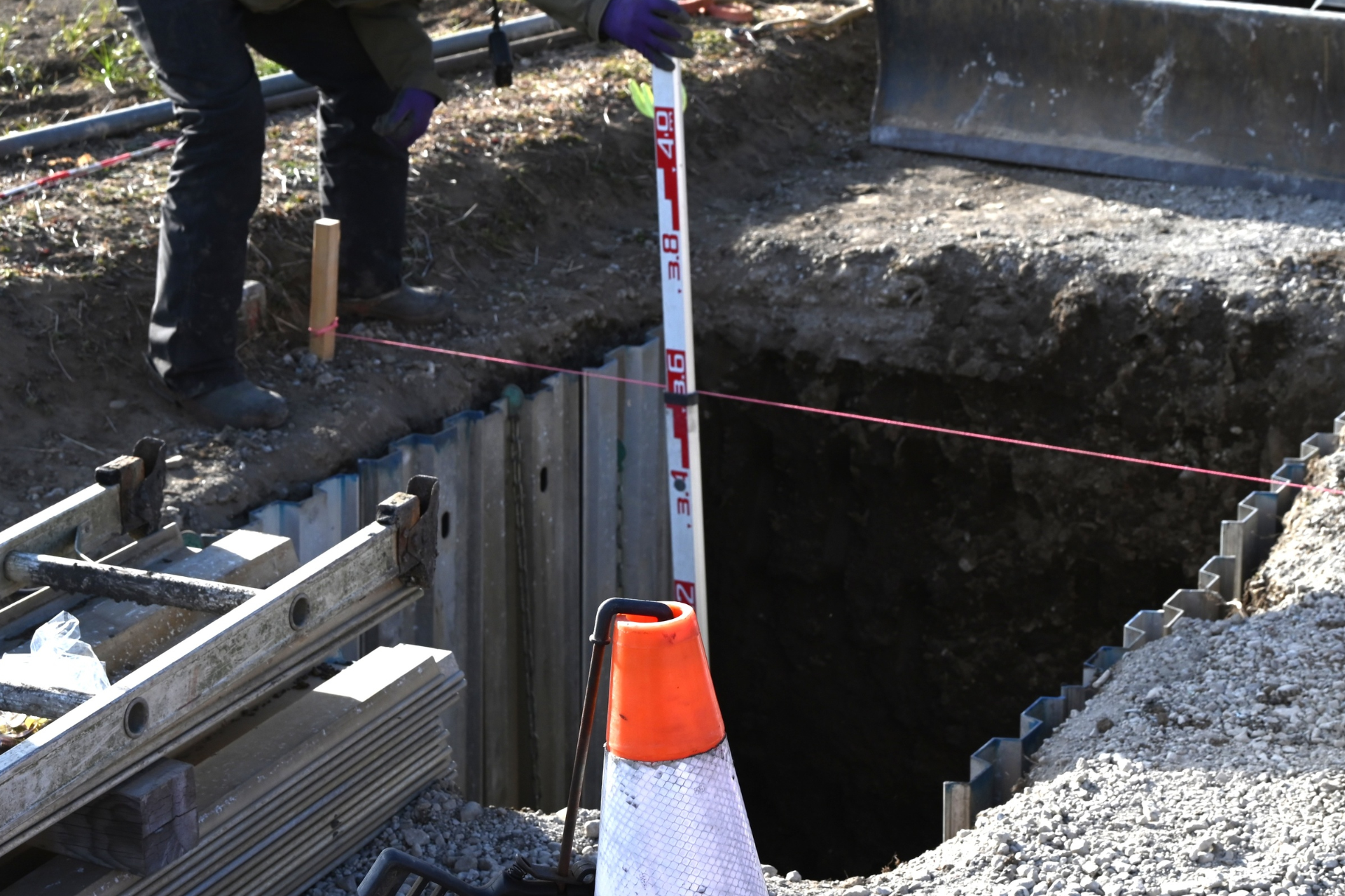 Hands washing under running water at a white sink with a chrome faucet