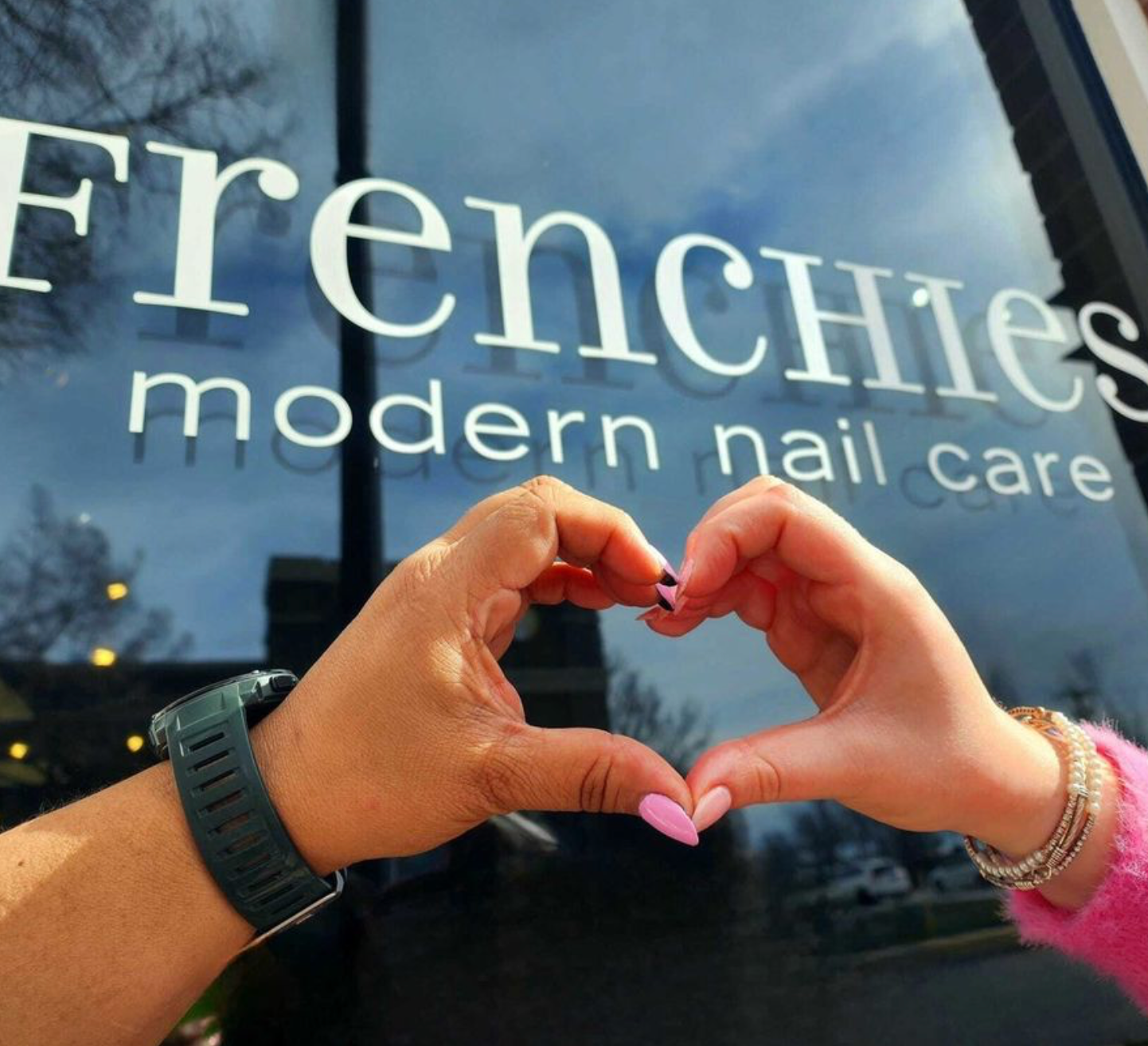 Frenchies Modern Nail Salon logo on glass front door