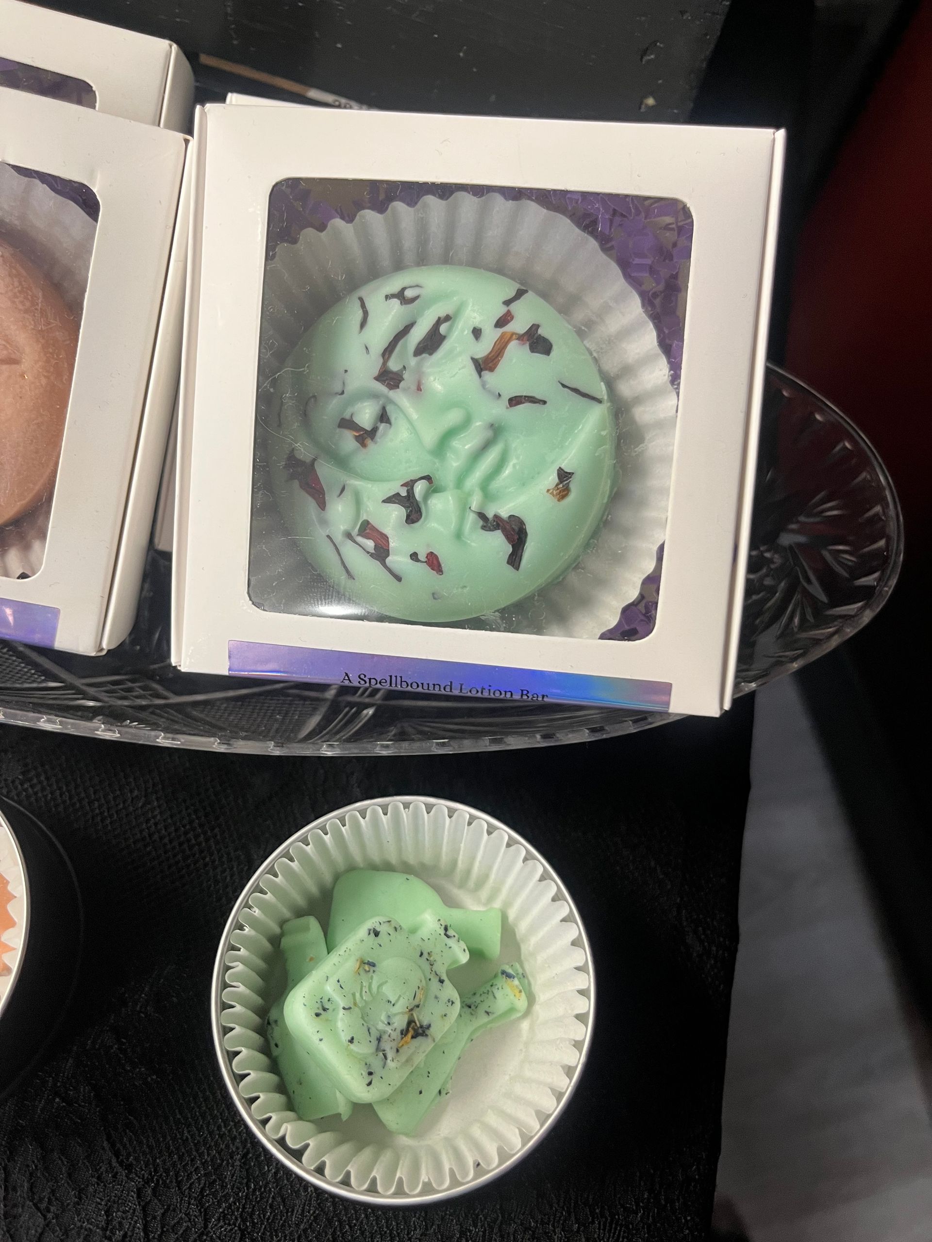 Mint green dessert in white paper cup and box, topped with chocolate shavings.