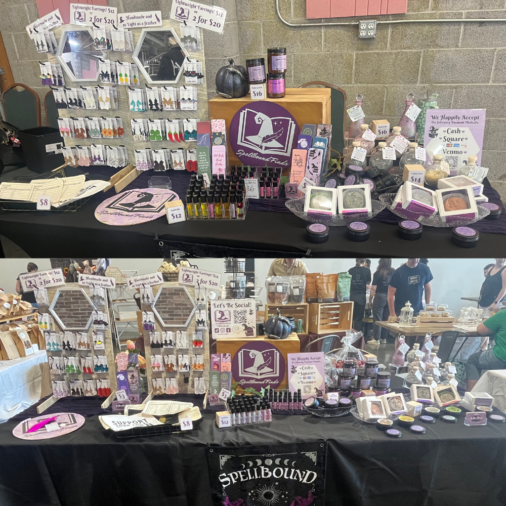 Vendor table with assorted handmade purple-themed accessories and displays at a craft fair