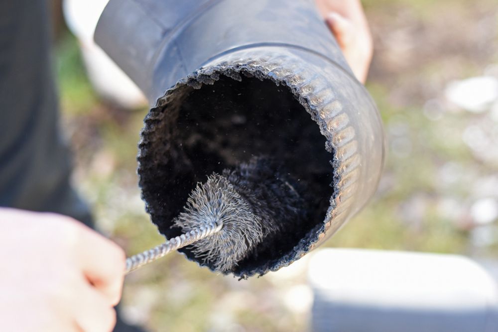Cleaning of chimney hose pipe — Handyman in Kiama, NSW