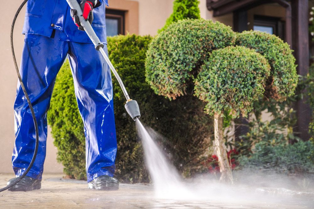 Property cleaning using water pressure — Handyman in Ulladulla, NSW