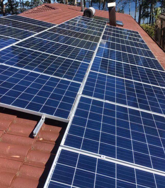Solar Panels On A Sunny Day — Gutter Cleaning In Shoalhaven, NSW