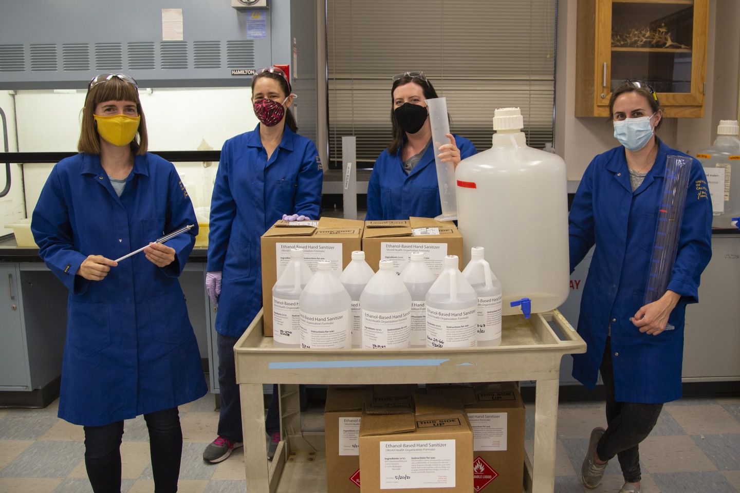 Group photo of Elizabeth Cash and colleagues after producing a batch of hand sanitizer.