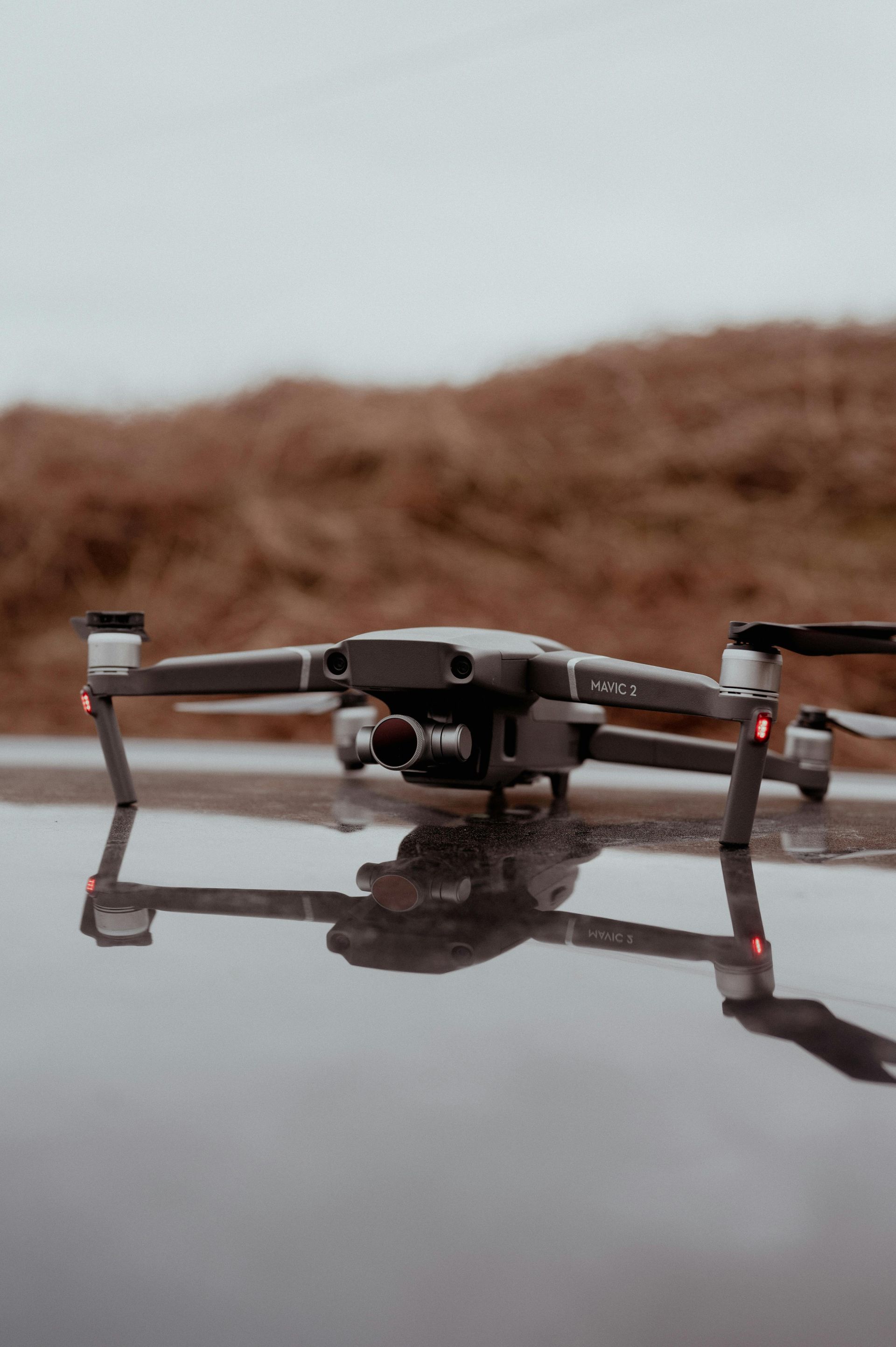 A pile of plastic pipes and blocks are laying on the ground. Inspected by drone.