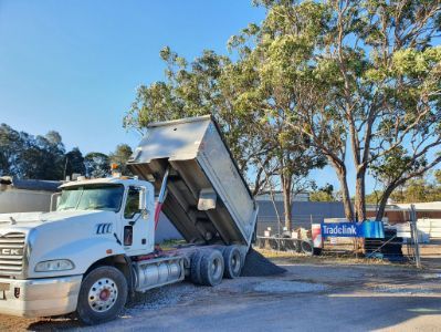 Truck Unloading Gravel — Landscaping Supplies in Port Macquarie, NSW