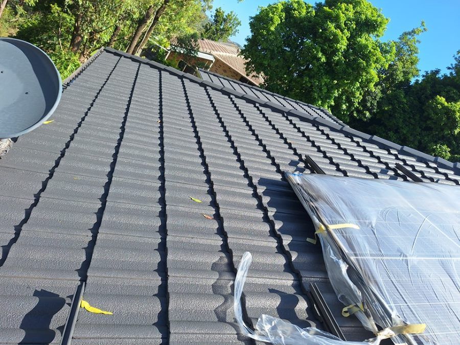 A Satellite Dish is on the Roof of a House — Roofing Gold Coast in Tallebudgera, QLD